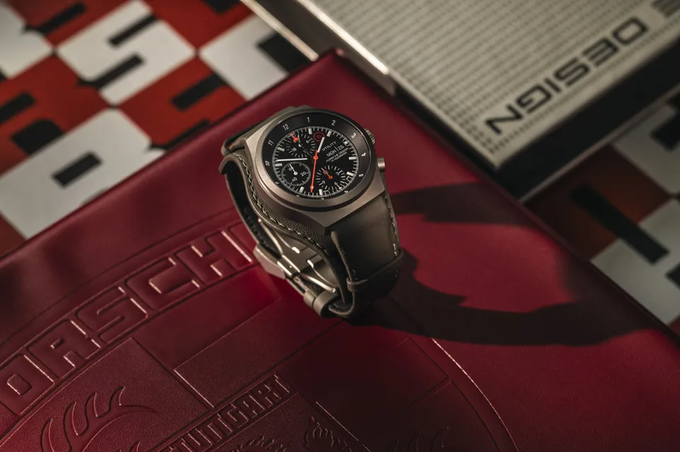 Porsche Design Chronograph 1 Utility, Limited Edition for Hodinkee, on a red Porsche Design book